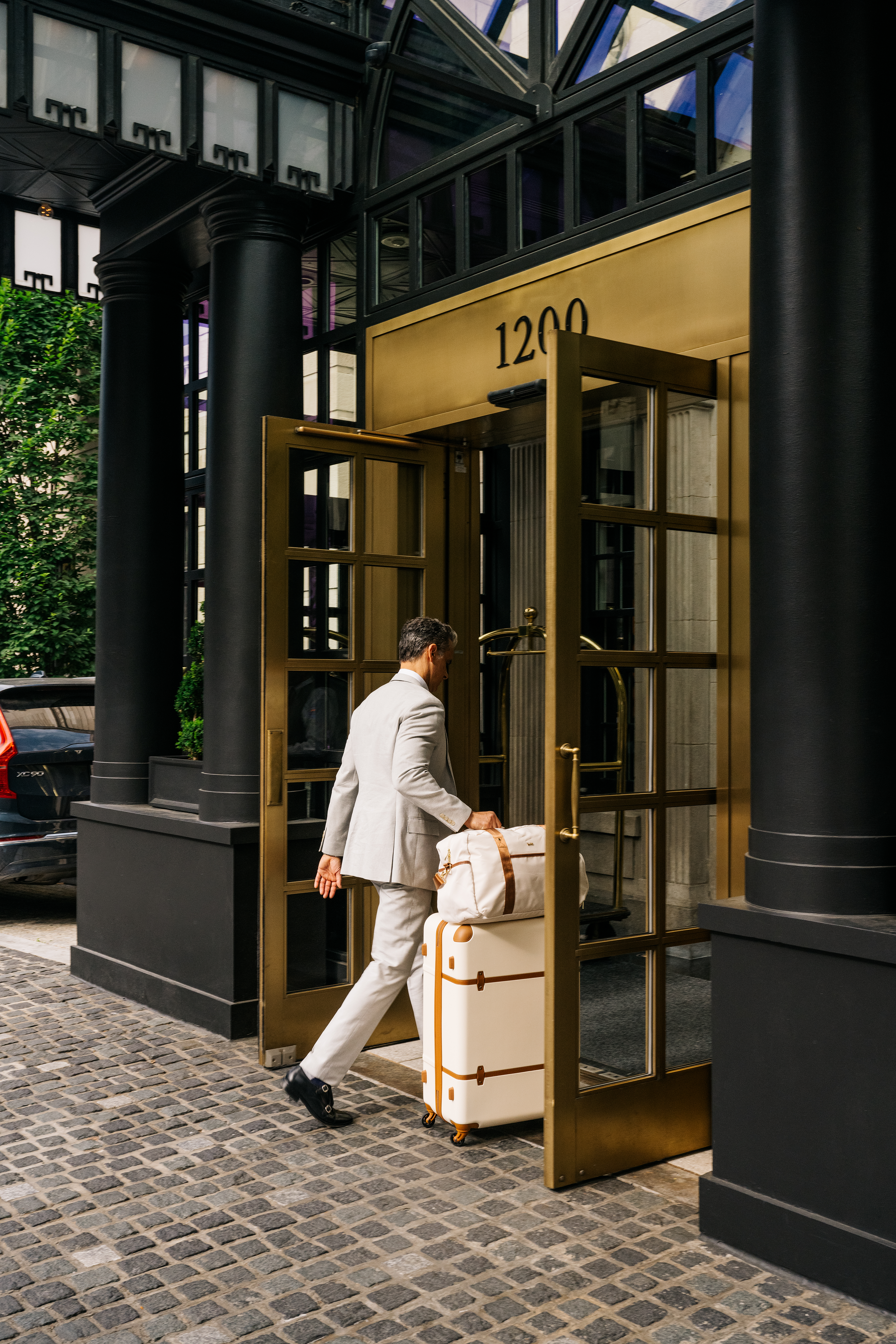 Guest arriving at hotel entrance with luggage