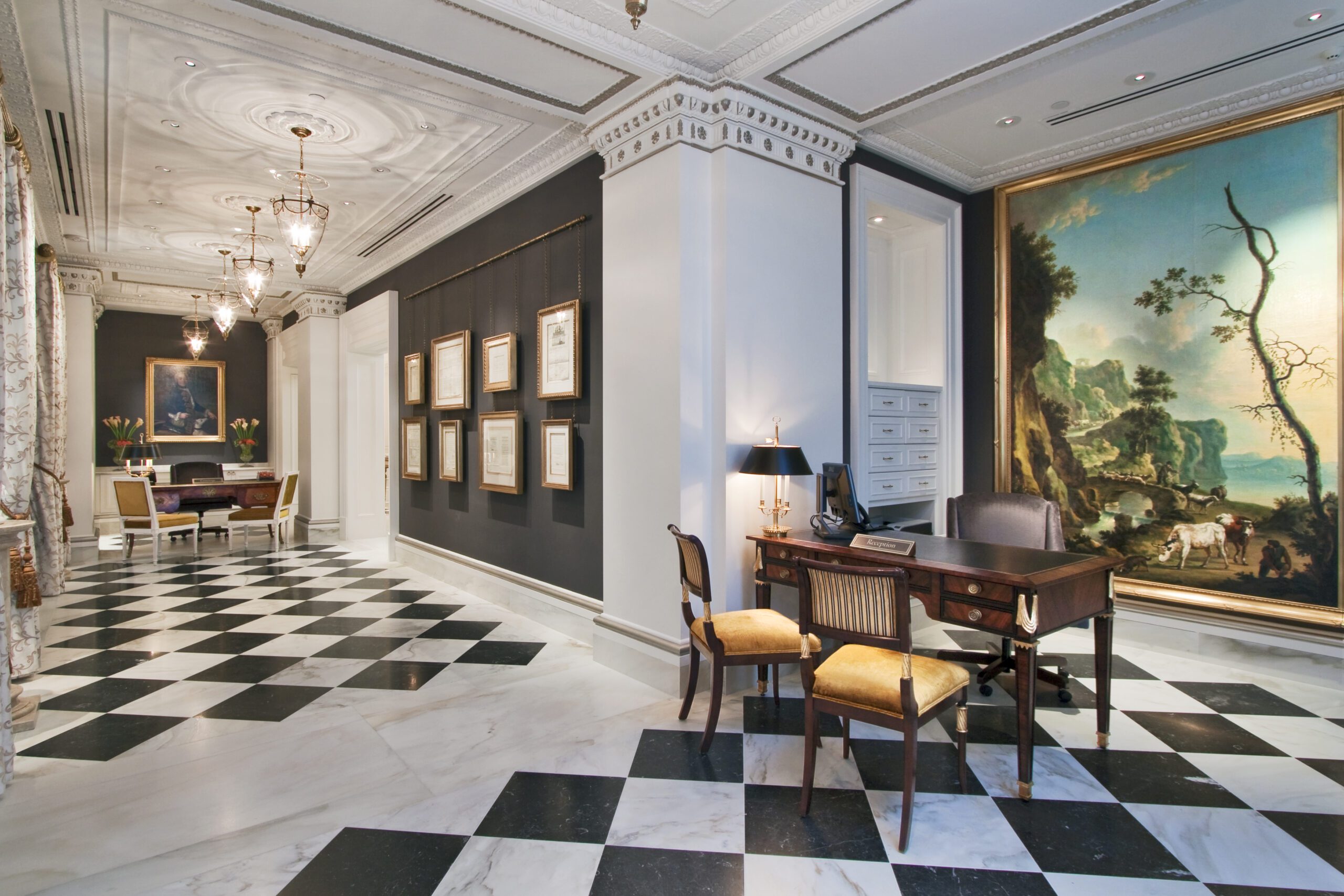 Elegant hallway with checkered floor and writing desk