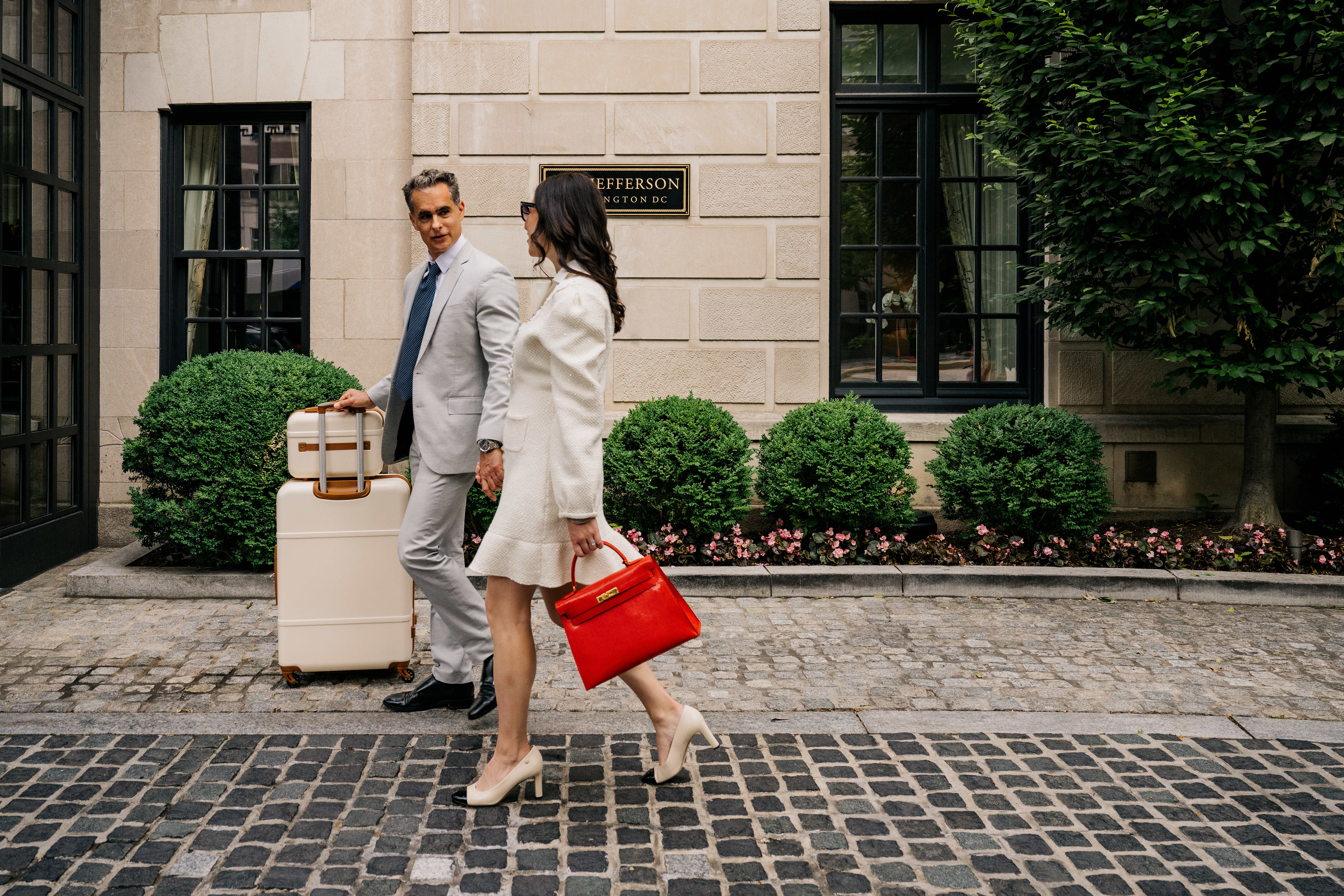 a couple walking in front of the Jefferson DC